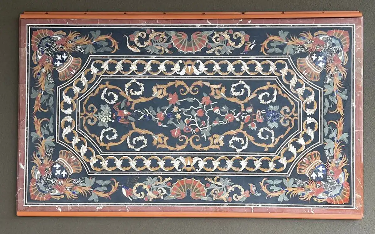 The same panel before restoration, with faded color