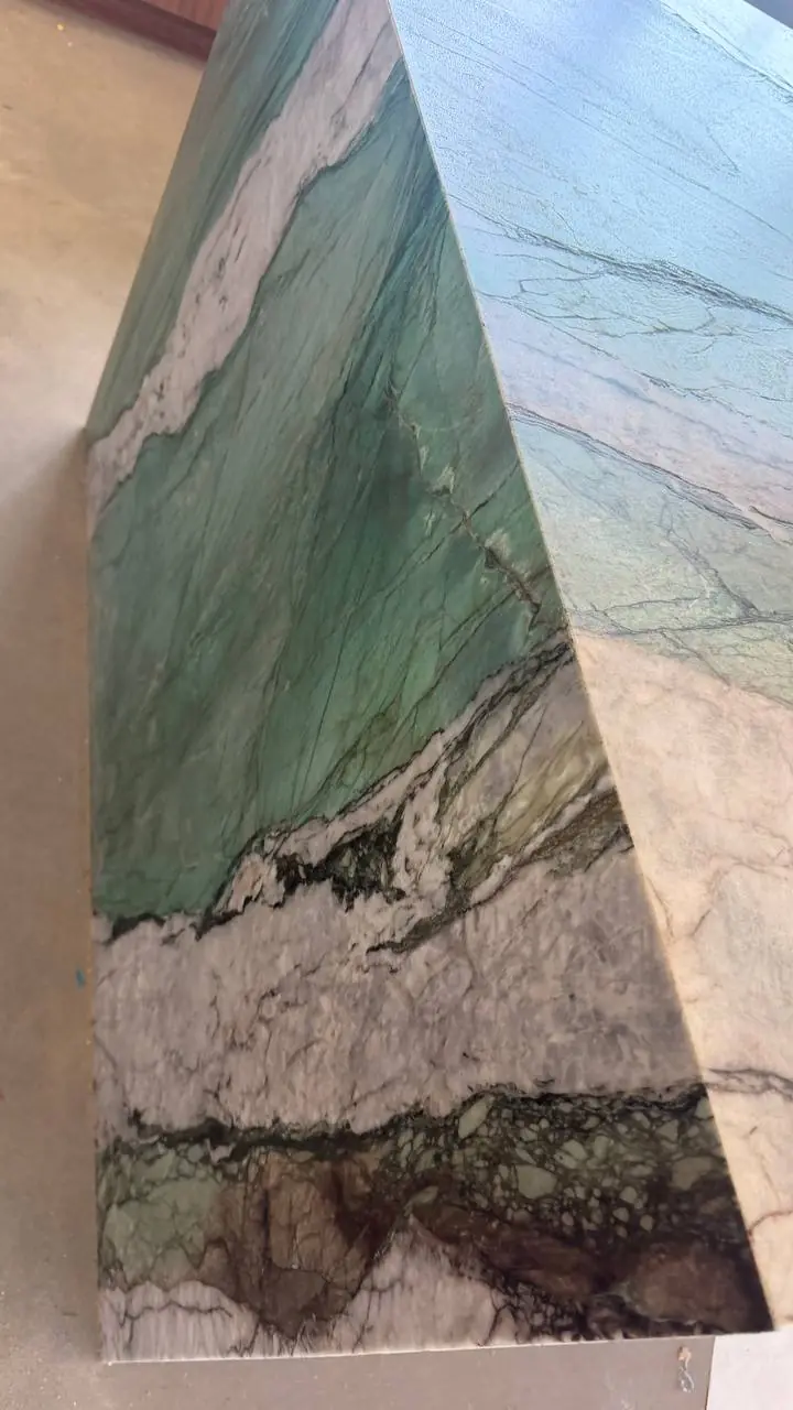 Mitered waterfall edge with book-matched veining